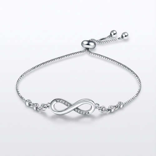 Silver bracelet with an infinity symbol on a light gray background